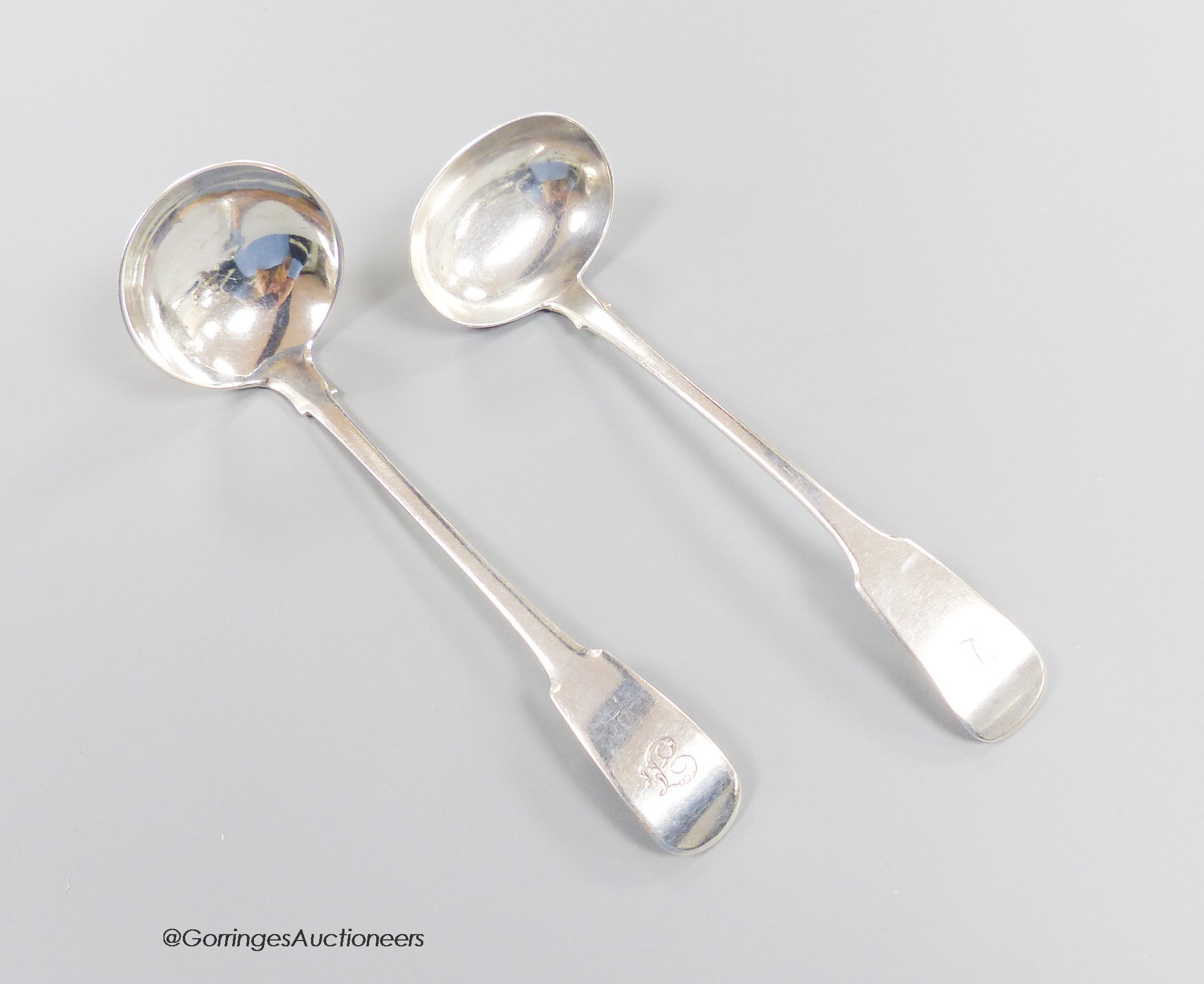 Two 19th century Scottish provincial silver fiddle pattern toddy ladles, George Elder, Banff, c.1825 and William Simpson, Banff, c.1840, longest 16.2cm, 62 grams.